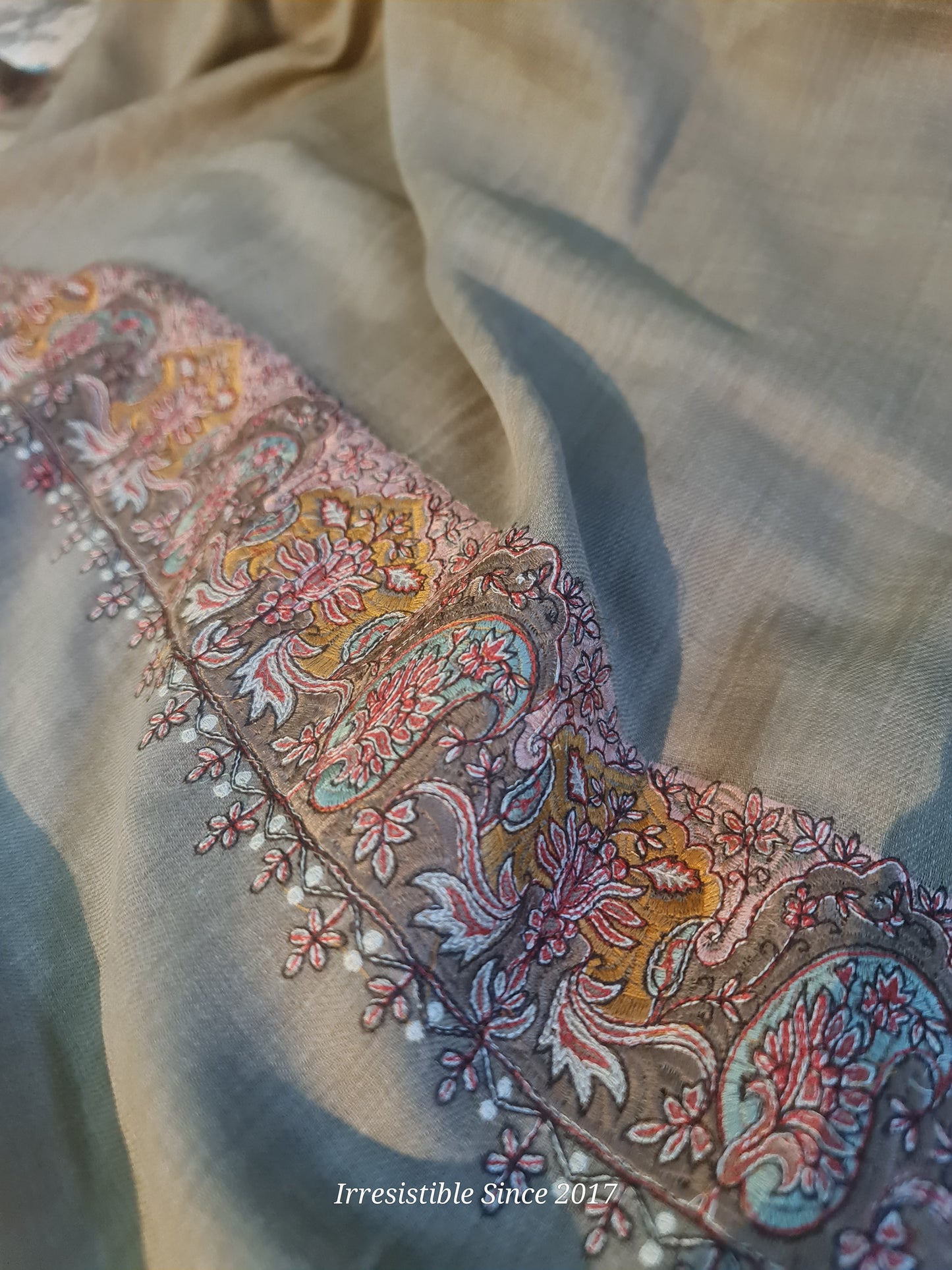 Embroidered shawl.