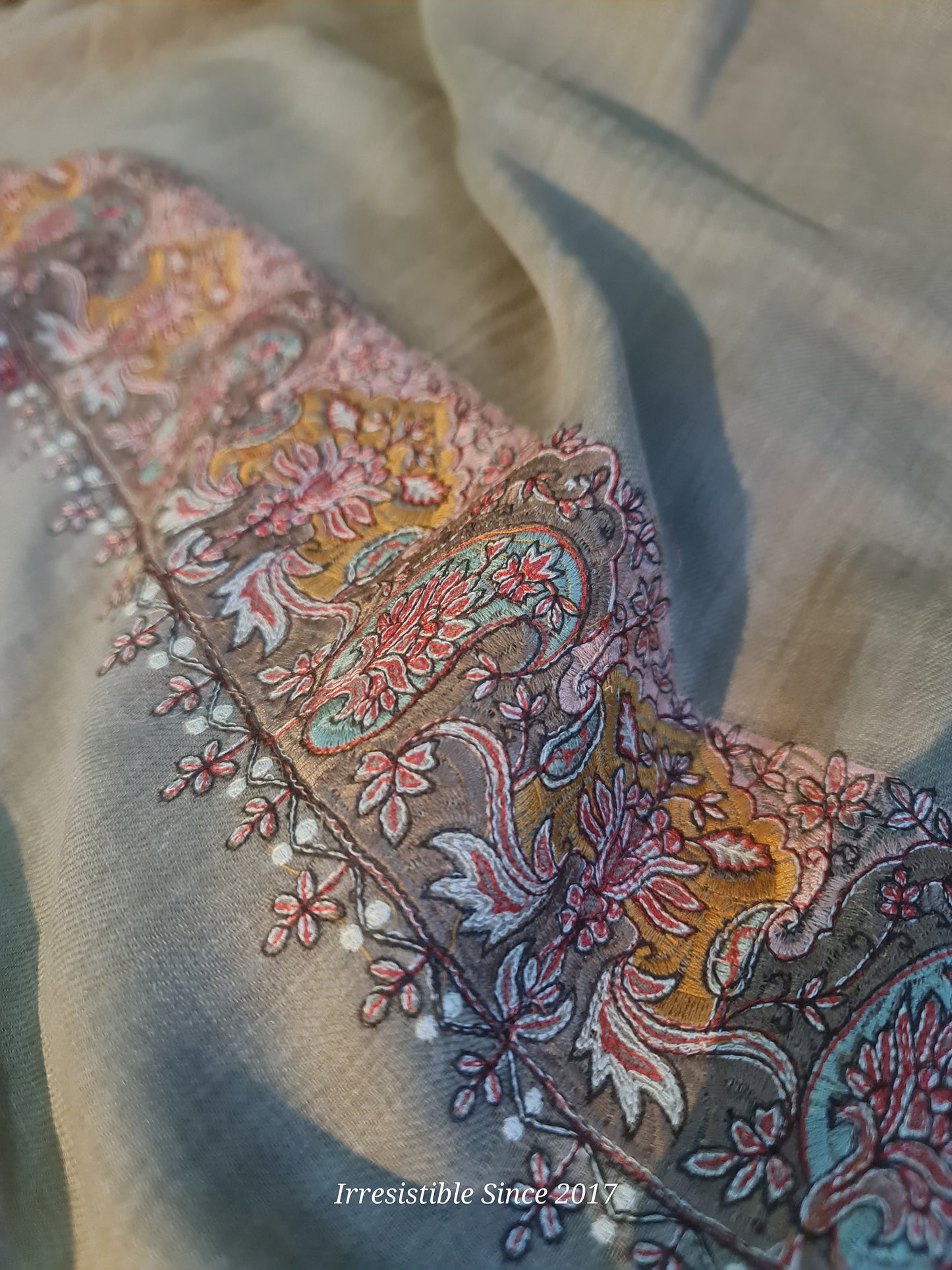 Embroidered shawl.