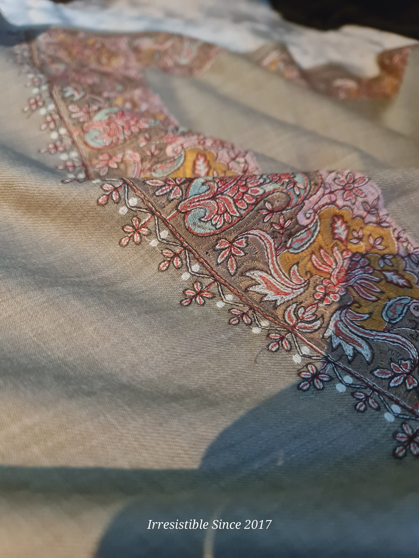 Embroidered shawl.