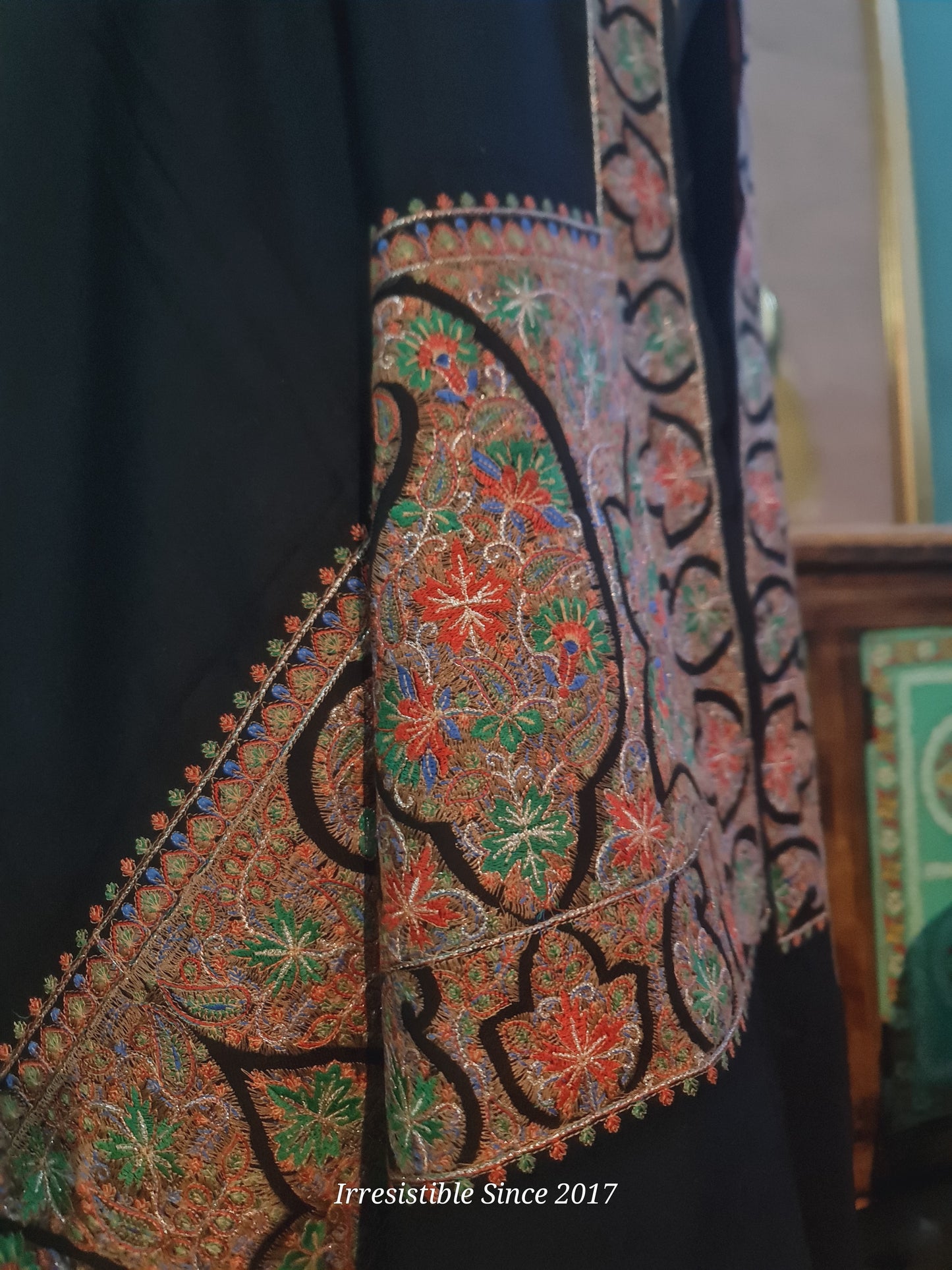 Embroidered shawl.